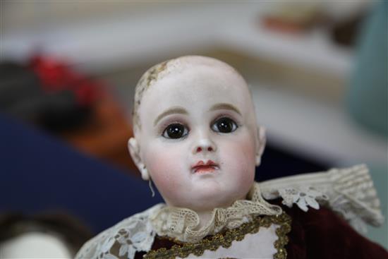 A Jumeau bisque head doll, stamped 7EJ, late 19th century, height 17.5in., small firing crack to right ear